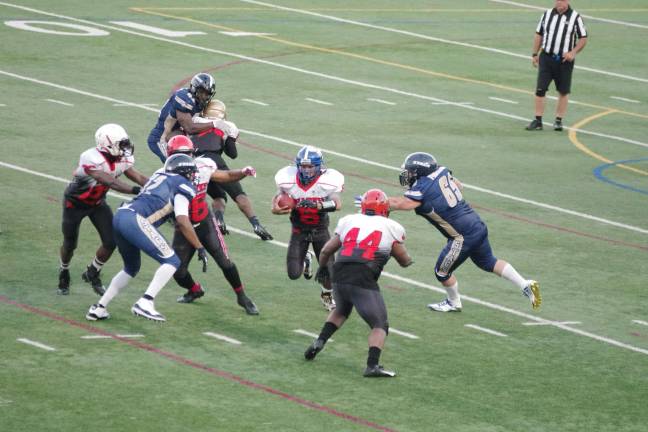 Sharks quarterback Santiago runs with the ball on a keeper in the first half.
