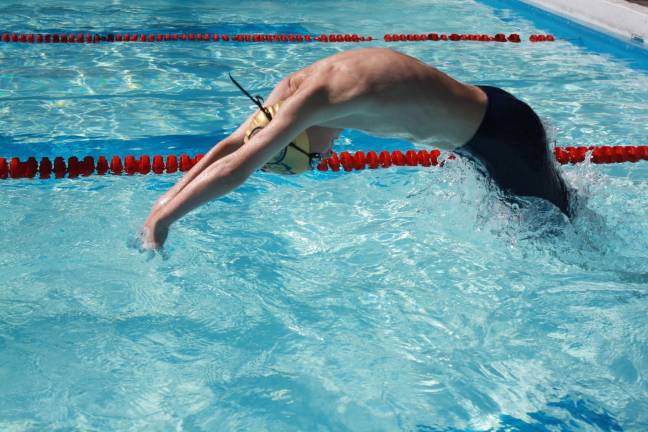 Carlen Rivielle, 13, takes a dolphin dive.