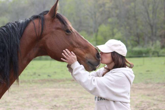 Diane Romano-Potocki with one of her beloved rescued horses.