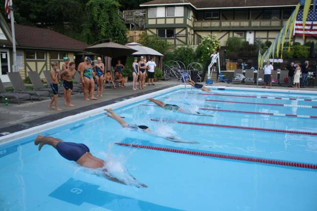 Swimmers dive in at Lake Mohawk Pool on Aug. 9 en route to defeating Fayson Lakes