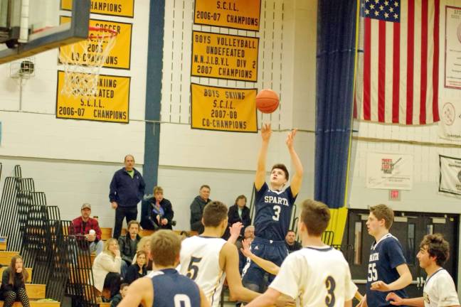 Sparta's Jack Cavanaugh lines up and shoots. Cavanaugh scored fourteen points. Photos by George leroy Hunter