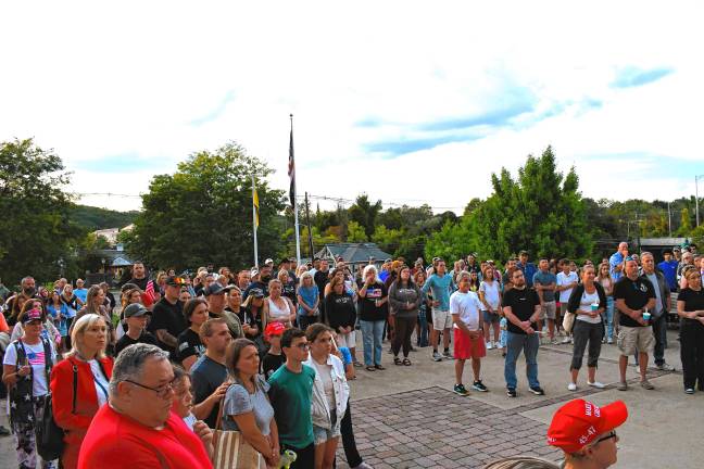 People attend a vigil Sunday, Sept. 14 in Sparta for Charlie Kirk, a political activist who was shot and killed Wednesday, Sept. 10 while speaking on a college campus in Utah. He was 31.
