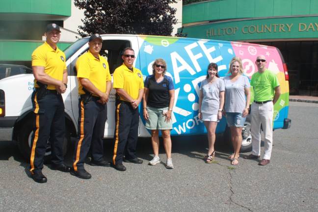 The Fraser Firm Attorneys at Law LLC held the 2nd Annual Car Seat Safety Day at Hilltop Country Day School. From left, Sparta Police Ptl. Tom Herd, Ptl. Steve Guido and Cpl. Kurt Morris, Child Passenger Safety Instructor Jackie Stackhouse Leach, Lauren Fraser of The Fraser Firm LLC, Tricia Salazar, The Fraser Firm LLC administrator, and Kevin Folan, Head of School at Hilltop Country Day School. Photos by Rose Sgarlato
