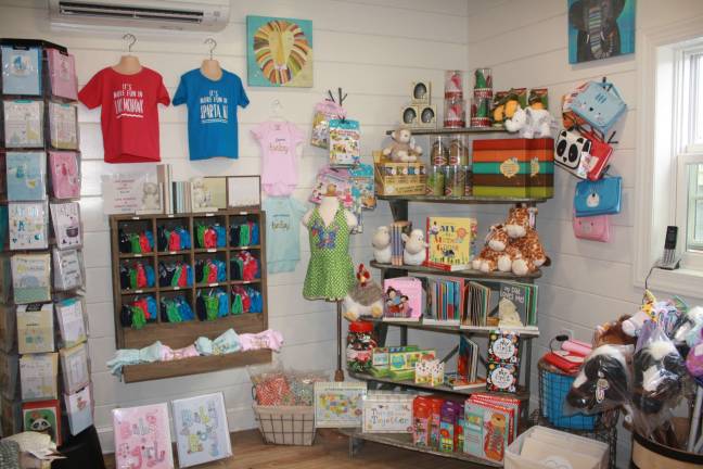 An array of gift items and Sparta specialty tees at Ava &amp; Jack Children's Boutique.