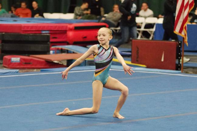 Westys gymnast Chelsea Smith is all smiles during a floor routine.