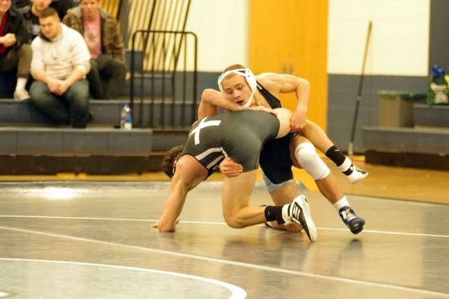 Sparta's Carter Sheridan takes down his Don Bosco opponent in the 138 lbs category. Sheridan won the match.