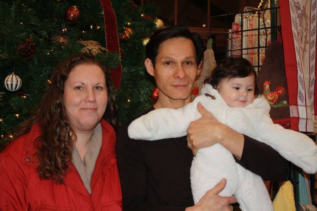 First time attendees and new Sparta residents Gretchen Winder, Rafael Ayvar with their 7-month old baby Antonia.