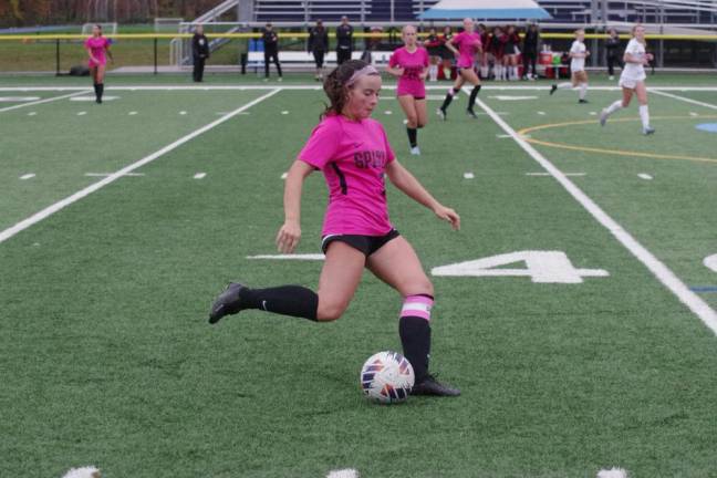 GS5 Sparta High School soccer player Bailey Brannigan is in control of the ball.