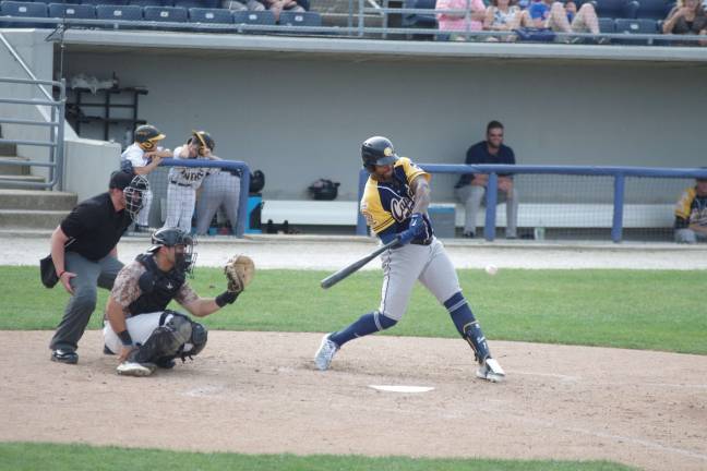 Québec batter Kalian Sams takes a cut in the third inning. Sams had 4 at bats producing 3 hits and 1 RBI.