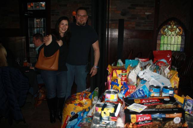 Heather and Scott Fradgen of Vernon add their pet food donation to the many at Mohawk House.