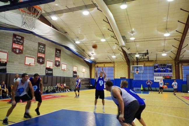 Team Synol's Frankie Rios launches the ball from the foul line.
