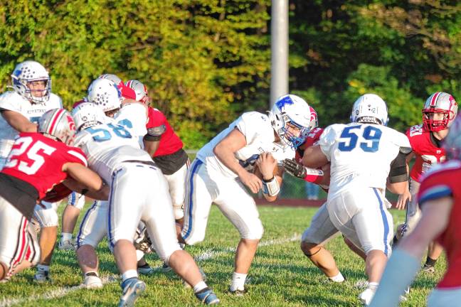 <b>Kittatinny quarterback Jack Brex runs with the ball. He made the Cougars’ only touchdown in the game.</b>
