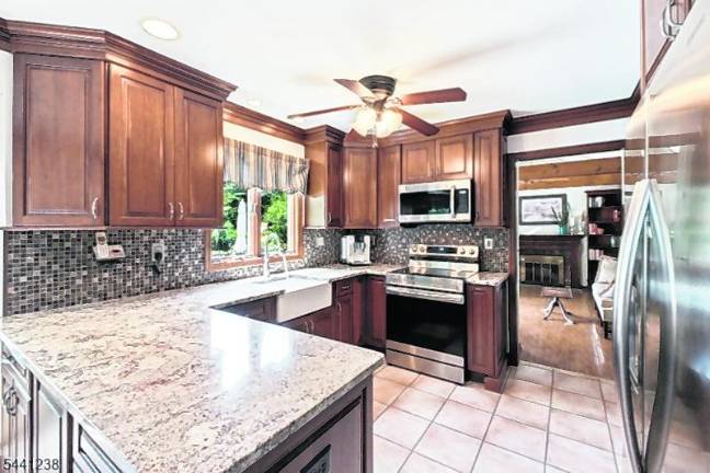 Sparta colonial features classic den, outdoor oasis