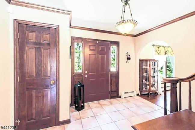 Sparta colonial features classic den, outdoor oasis