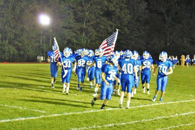 The KRHS football team enjoys a night game under lights provided by the KCAA. One of the KCAA's big contributions to the school is The Week of Lights where all fall sports teams get to play at night. Photo provided