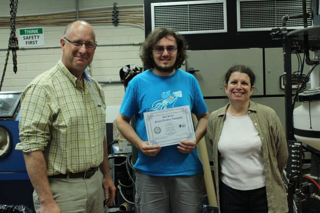 Chris Land - engineering and physics teacher, Max Bareiss - engineering/ physics student and Mary Rapuano - Sussex County Technical School's Merck State Science Day competition coordinator
