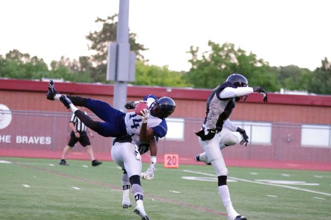 In the second quarter Sussex Stags receiver Tyler Adams catches the ball in double coverage by Central Pennsylvania Piranhas.