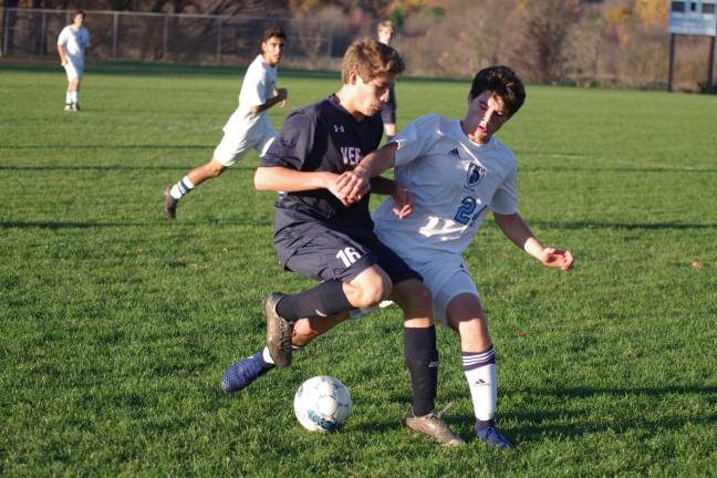Vernon's John Gindhart and Sparta's Nick Butera clash for control of the ball.