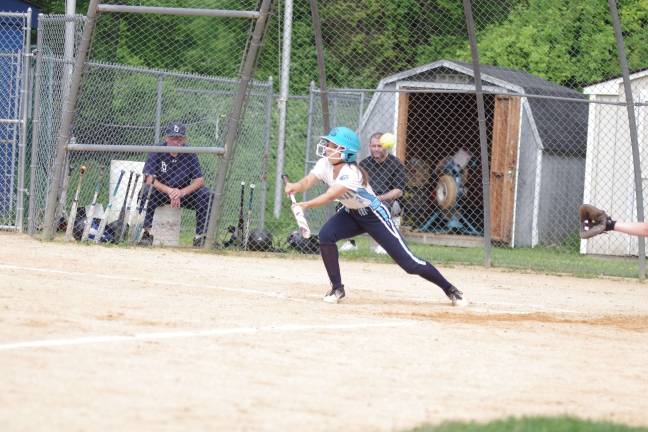The ball sails into foul territory after Sparta batter Isabella DeFilippis connects during a bunt attempt in the fifth inning. DeFilippis had two hits with a double and two RBI.