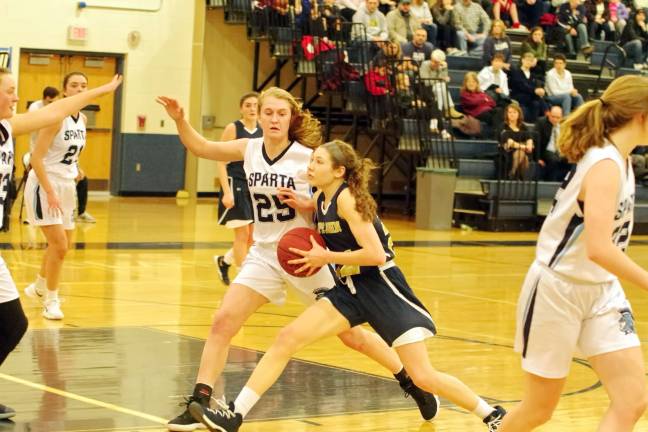 Photos by George Leroy Hunter Sparta's Paige Smith covers Pope John ball handler Kenna Squier in the second period.