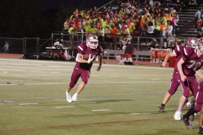 Newton running back Anthony Tudda is on the move with the ball in the second quarter.