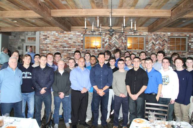 The Sparta High School football team with New York Giants Steve Weatherford.