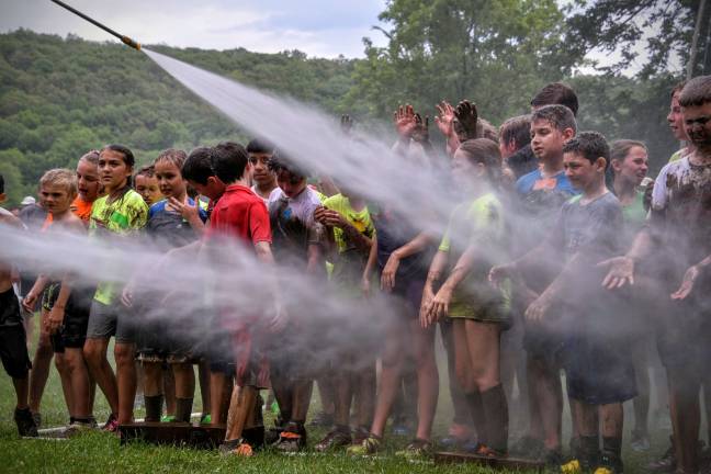 Participants get cleaned off after the race.