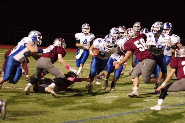 Kittatinny ball carrier Anthony Cagno is confronted by Newton defenders in the first half. Cagno scored a rushing touchdown in the second quarter.