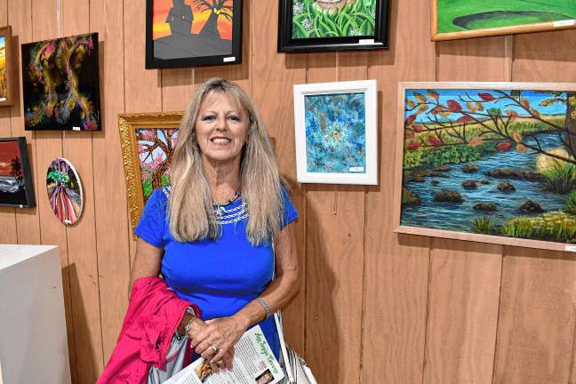 <b>Artist Lorie Krieger with her acrylic painting ‘Quiet Beauty.’</b>