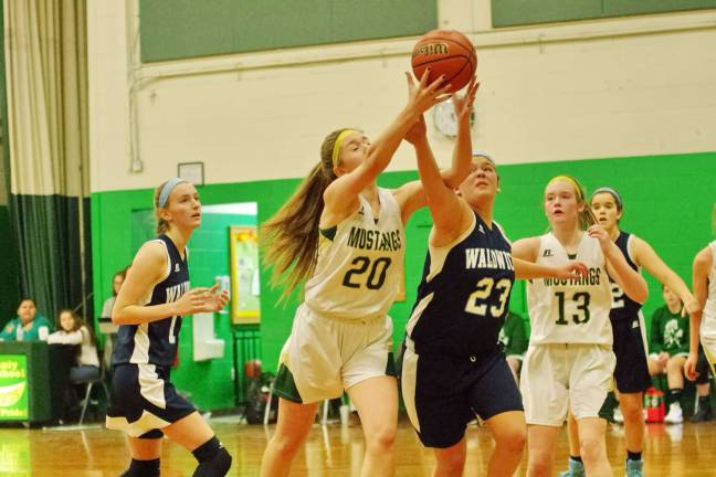 A Sussex Tech Mustang and a Waldwick Warrior battle for a rebound. Photos by George Leroy Hunter
