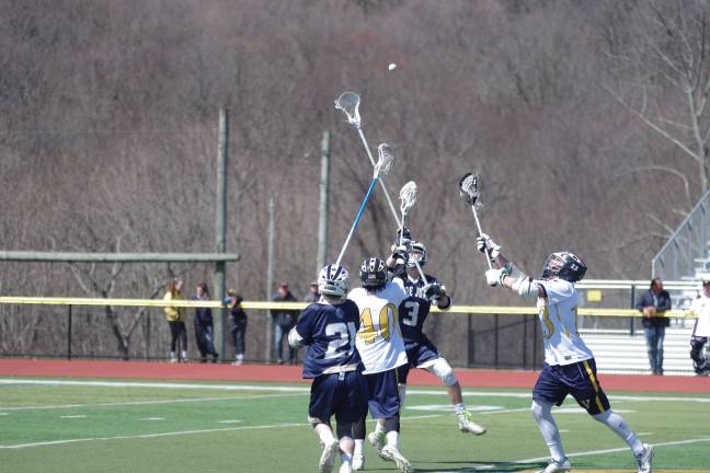 Pope John Lions and Vernon Vikings fighting for the ball.