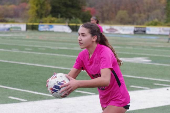 Sparta High School soccer player Gina Stankiewicz is about to put the ball in play.