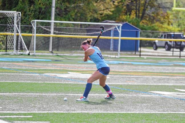 Sparta's Leah Albers is about to hit the ball.