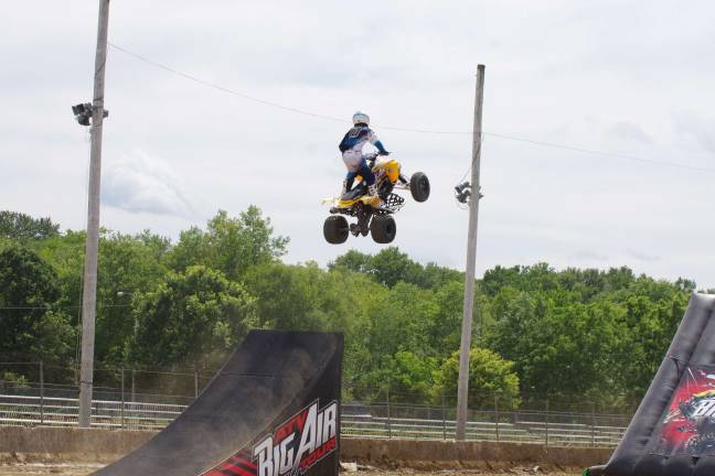 Stuntman Derek Guetter takes his all terrain vehicle to a high level during a jump.