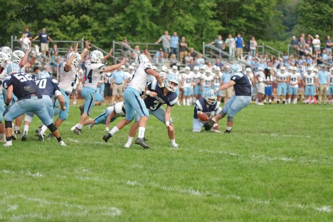 Sparta's Reed McCall executes an extra point kick in the second half.