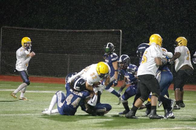 The Stags defense take down a Knights ball carrier in the third quarter.