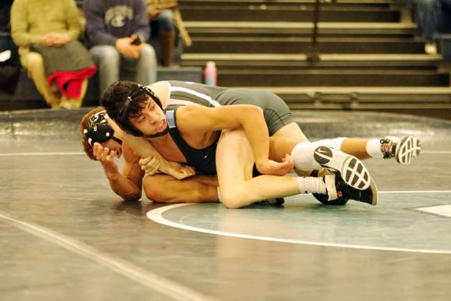 Sparta's Christopher Hwang grapples with his Don Bosco opponent in the 126 lbs category.
