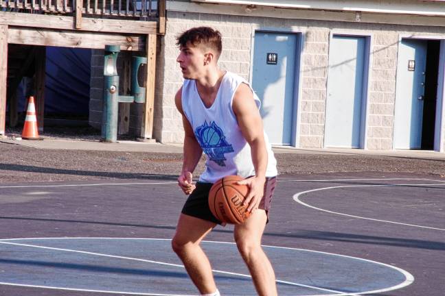 Team Smalley's Matt Moran handles the ball in a game against Team Mastandrea. He is a graduate of Jefferson Township High School.