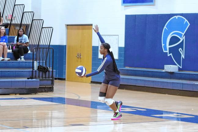 Sparta's Grace Mathurin in the midst of a serve.
