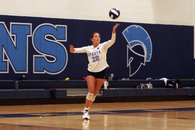 Sparta volleyball player Lea Tsamadias in the midst of a serve. Tsamadias is credited with six kills, two digs and one ace.