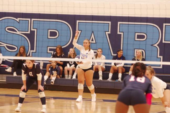 Sparta volleyball player Giselle Faria with the ball. Faria accomplished 12 assists, six aces and three digs.