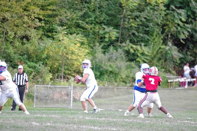 <b>Kittatinny quarterback Jack Brex is about to throw the ball.</b>