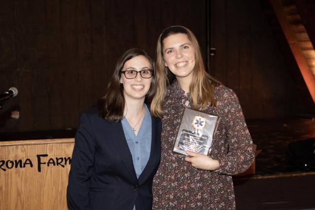 SQ5 Alex Castiglia presents the Employee of the Year award to Sarah King, left.