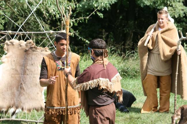 Mohawk Chief (Frank Cutrone in center) hands off leadership staff to his brother (Ben Insley) while his nephew (Ed Weaver) observes in background