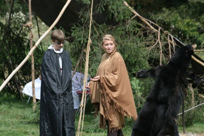 Jesuit missionary (Collin Tully) shares God&#xfe;&#xc4;&#xf4;s word with the teen Kateri (Rebecca Proctor)