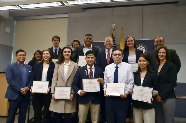 Rep. Josh Gottheimer and others pose with students nominated to the U.S. Air Force Academy.