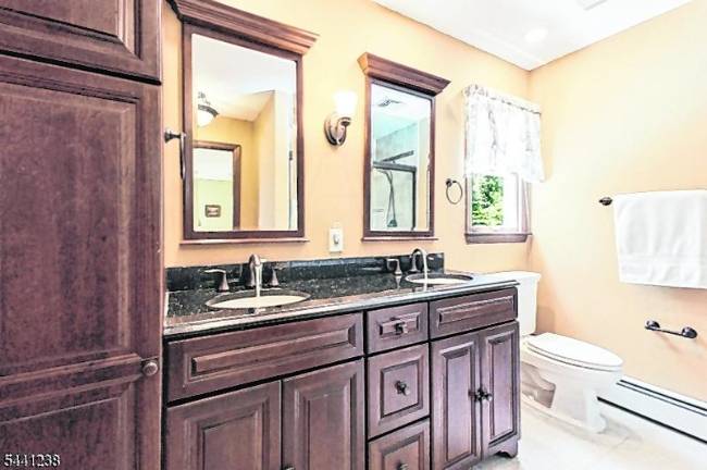 Sparta colonial features classic den, outdoor oasis