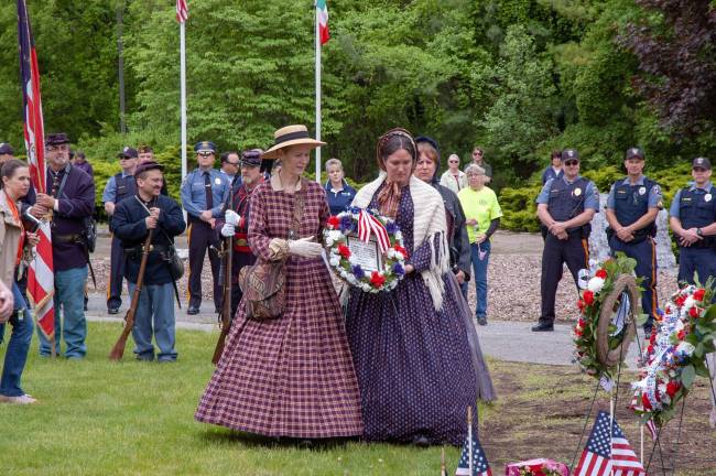 Re-enactors laying a wreath