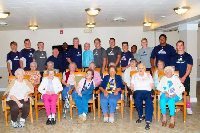Pope John Juniors, (left to right) Rob Health, Nick O'Leary, Brian Dolan, Coach Kyle Roundtree, Coach Brian Carlson, John Cotis, Ricky LaPolla, Brendan Schuldner, Kevin Paul, Matt Dengler, Dylan Wade Perry and Tyler Johnson with Knoll View residents; Betty Sparling, Clara Roux, Judi Genthon, Anita D'Amico, Laura Myhre, Millie Lojpersberger, Second row, left to right: Shirley Dunn, Louise Crowell, Muriel Paulison, Terry Kirchdoerffer, Catherine Salerno, Gerry Hill, Sandra Sutton. Back row with players, Robert Taylor and Wayne Earl.