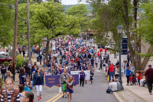 Spectators fill the street at parade's end